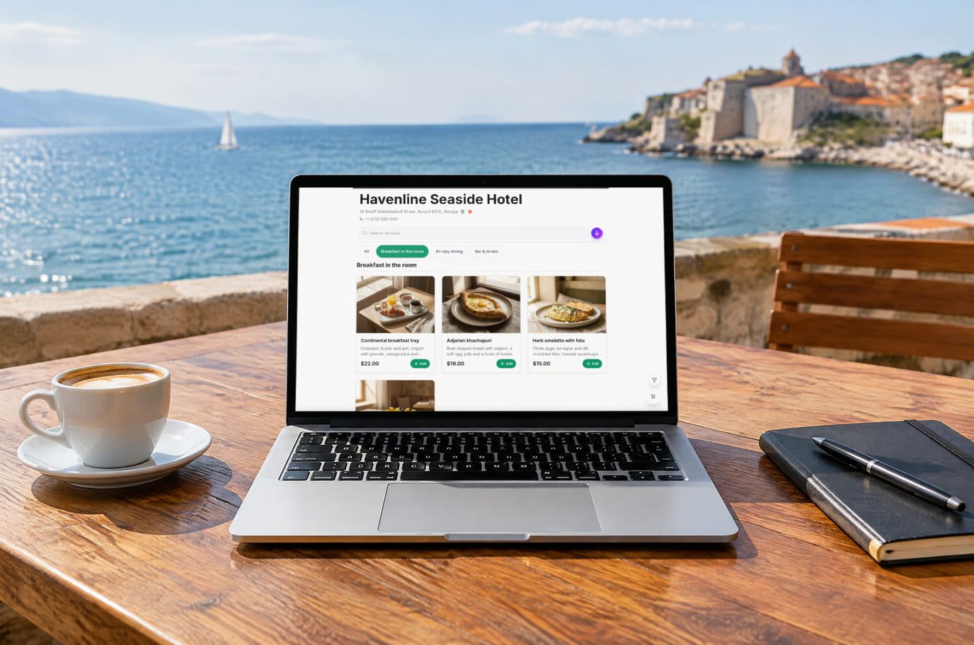 The hotel website on a laptop: hotel name, search and the “Breakfast in the room” menu with prices