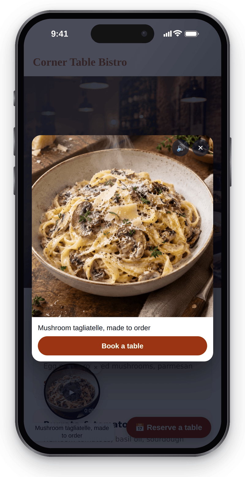 The opened video bubble on a phone: a dish clip, the mushroom tagliatelle caption and a Book a table button